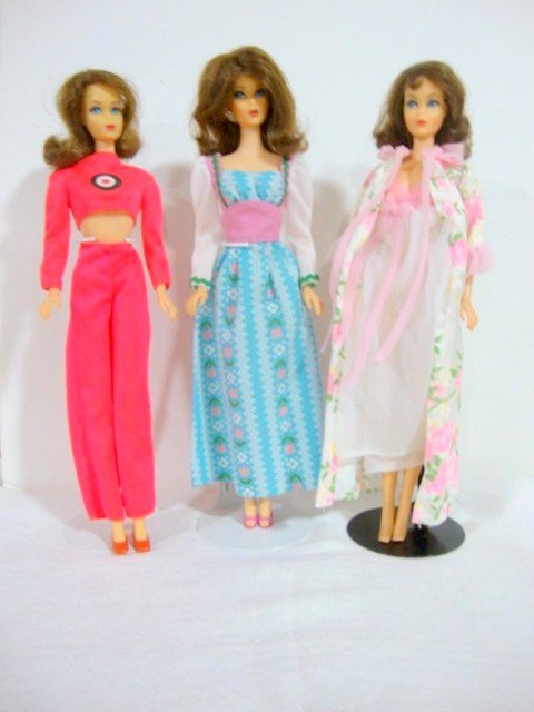 3 Brunette Flip TNT Barbie: 3 Brunette Marlo Flips. Some touchups, one face a little dark. Wearing Best Buys 9960, 9555 and 8690