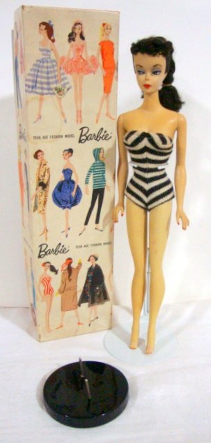 Brunette #1 Barbie: Brunette #1, Possibly restored. Not faded, but a bit darkened. No metal in legs, but holes are there. Comes with Box and reproduction stand