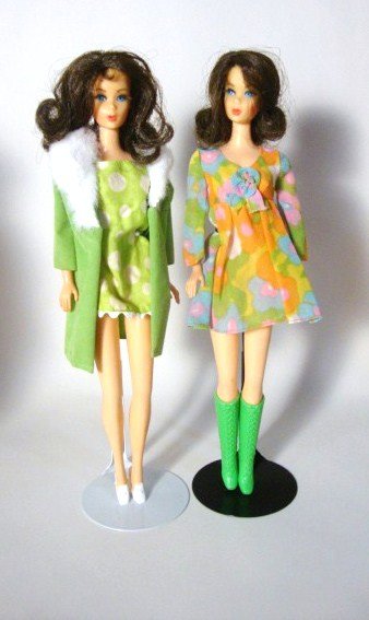 2 Mod Brunette Flip TNT Barbies: 2 Brunette Flip TNT's. Wearing Sears Fashion dress and Coat (Coat has rips and stains) and Flower Wower