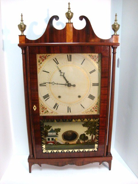 Eli Terry Pillar & Scroll Clock: Eli Terry Pillar & Scroll Eight Day Clock, with paper label , painting on door is copy of original but the door is original.