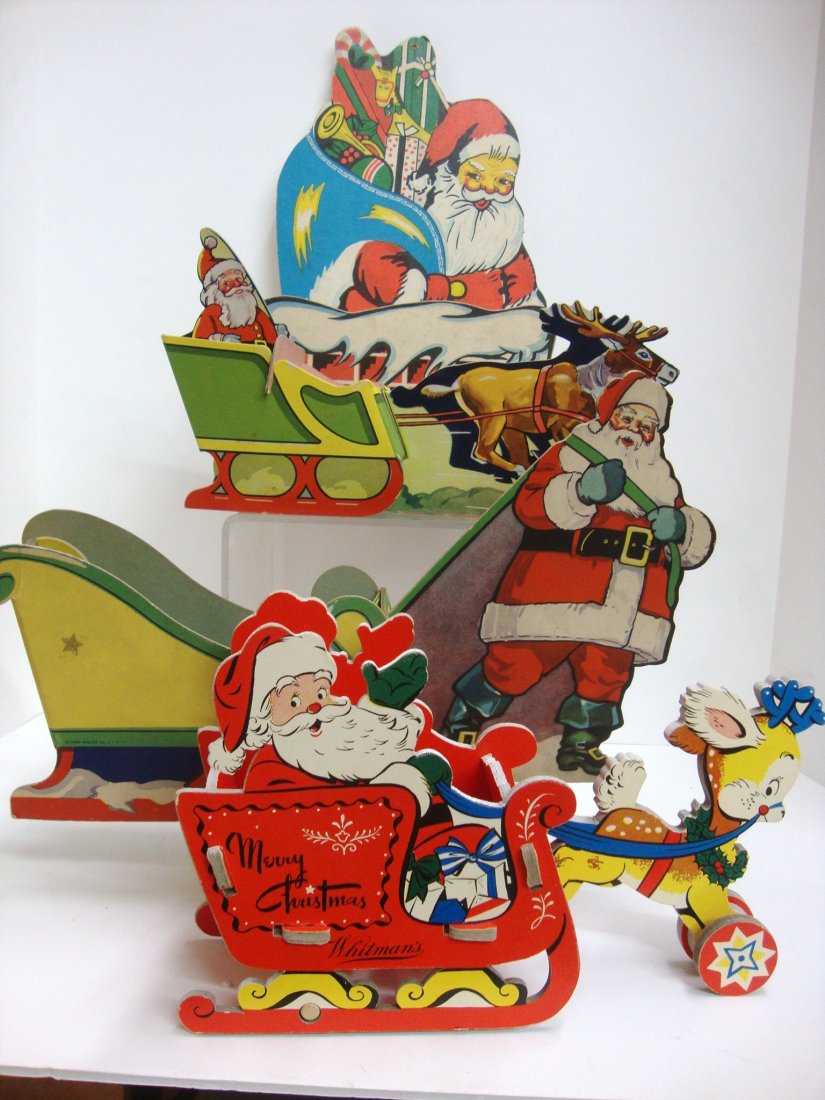 Santa Candy Displays: Four Santa Candy Displays, the tallest is 14" in, each are vintage candy displays.