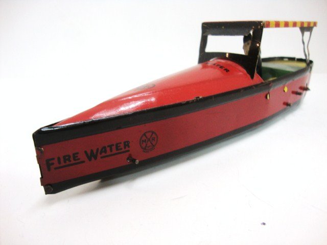 Marx " Fire Water Boat " Tin : Rare 9" Long Fire water Wind-up boat, with excellent Litho, and driver. it is in working condition.