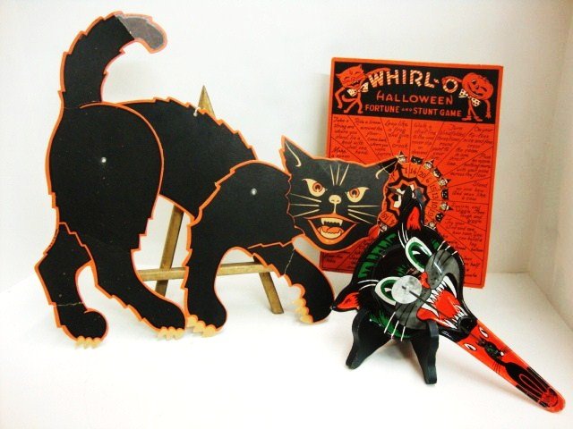 Halloween Decorations and Noisemaker: Tin cat noise maker (metal toy U.S.), cardboard "Whirl-O" game & adjustable cardboard cat (cat 17" (l))