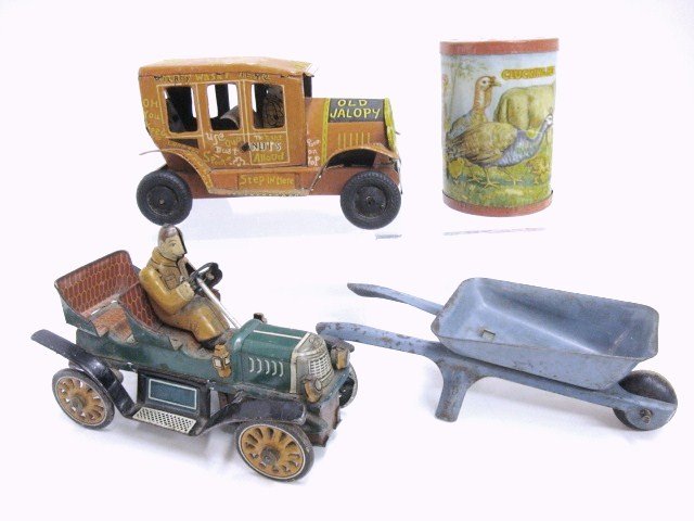 Two Tin Friction Cars , Clucking Hen Noise Maker a: Line Mar Old Jalopy 5", Touring Car 4 1/2", Wheelbarrow 5 1/2", Noise maker 3"