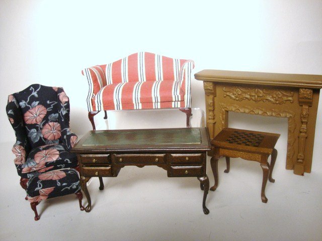 Dollhouse Settee & Formal Furniture: Settee, Floral Arm Chair and stool, Leather top Desk, Carved and Painted Fireplace and chess table. All unmarked. Fireplace largest 4 1/4 x 5 1/2"
