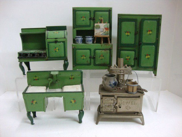 Early Miniature Tin Kitchen Set and Jewel CI Stove: Painted Tin Kitchen Set, Green with painted flowers, 7 1/2',largest, Sink, Sove, Cupboard and Ice box., together with Cast Iron Jewel Stove 6", Pottery some contemporary 1 1/2 "