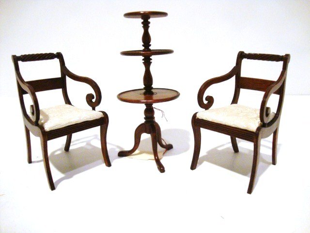 David Booth Regency Chairs and Dumbwaiter: A pair of handsomely carved Regency chairs with scrolled arms and a dumbwaiter 4" H, all signed by David Booth.