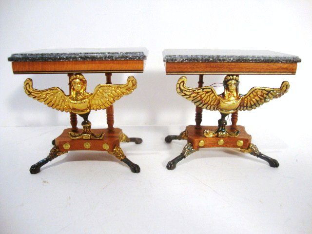 Tony Jones Console Tables: Delicate and striking pair of granite-topped neo-classical pedestal console tables with lion's paw feet and richly ornamented with winged caryatids. 2.5" H and 2.75".
