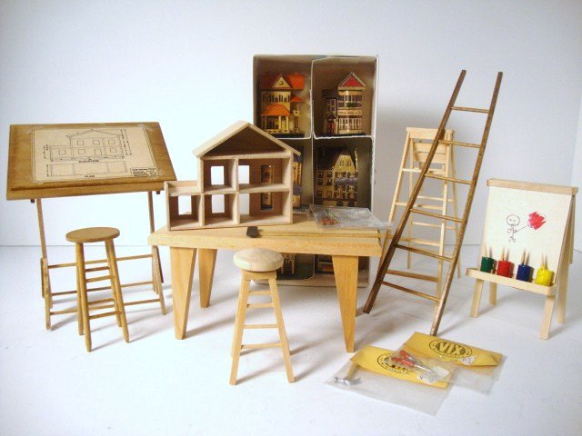 The Dollhouse Architect: A large assortment of furnishings and accessories for a small architect including drafting table 5" H, 4" W, work table, stools, ladders, child's easel, and miniature dollhouses. Nice group.