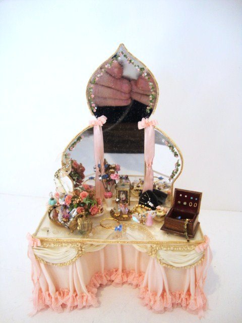 Judee Williamson Vanity: A completely over-the-top lady's dressing table with draped and pleated skirt, glass top, loaded with accessories and handsome triptych mirror with a Moorish profile and hand-painted decoration. A rea