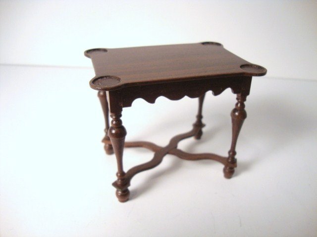 Gerald Crawford Game Table: A William and Mary cross-braced porringer top games table with recessed wells, trumpet legs and scalloped apron 2.5" H, 3" L.
