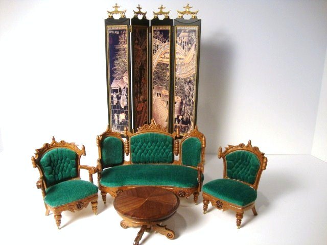 Leonetta Green Parlor Suite: Late Victorian carved parlor suite with tufted velvet upholstery, settee 4" H, 6" W, a Brooke Tucker Japanese folding screen 8.25" H and a round commercial table.