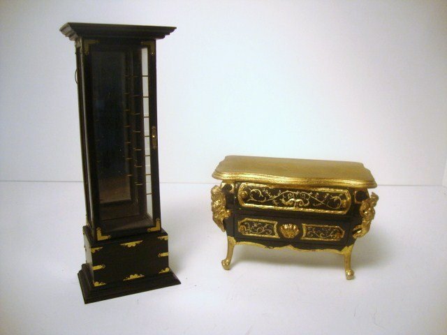 Judy Beals Lacquer Display Cabinet: A refined black lacquered cabinet with brass mounts, glass shelves and lighting by Judy Beals 6.75" H along with an unsigned Louis XV commode.