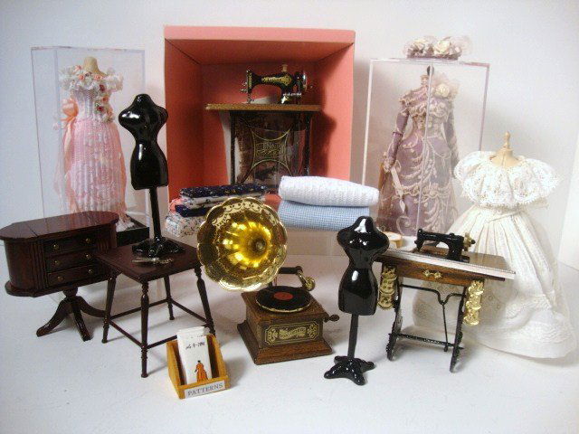 The Dressmaker: Large group of items for a dressmaker's shop: beautifully dressed mannequins, Bodo Hennig sewing machine and other accessories. Fun lot.