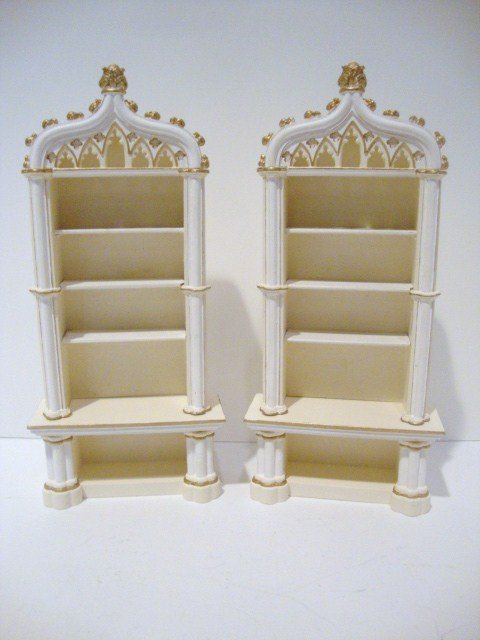 Sue Cook Bookcases: A pair of cast plaster architectural bookcases with Gothic styling and gilt details. 8" H.