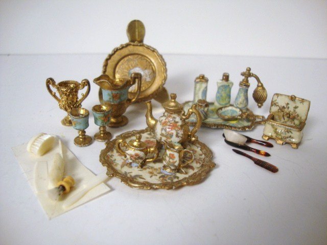 Lady's Dressing Table Items: Stunning carved ivory accessories by David Edwards comprising two hairbrushes, a shaving brush, two combs and a toothbrush. Shaving brush not even 1/2" L. Also a tortoiseshell set of brush, mirror and