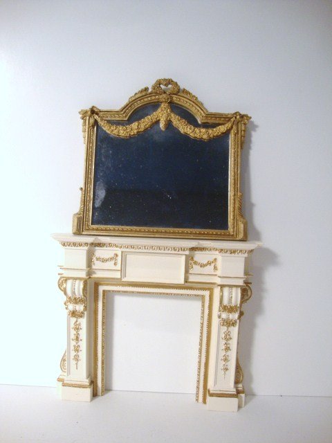 Sue Cook Georgian Fireplace: Handsome plaster fireplace with gilt highlights and large gilt overmantel mirror. Fireplace 5" H, 6" W, mirror 4.5" H.