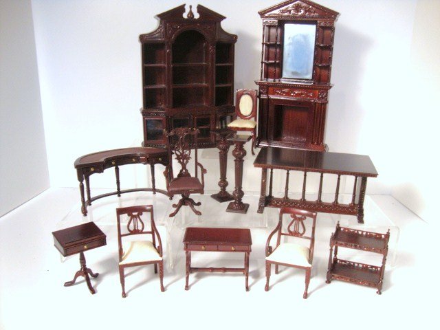 Bespaq Study: A very formal and imposing bookcase 8" H, 5.5" W, carved fireplace with mirrored chimney breast, an unusual demilune desk with inset leather top and matching swivel chair, an elegant library table, ad