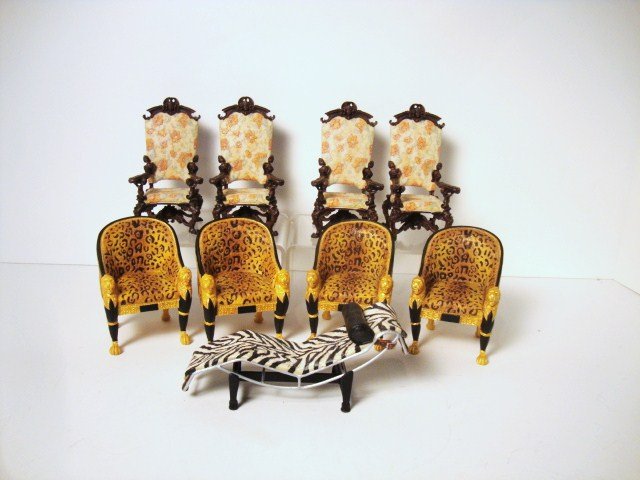 Take A Seat by Raine Chairs: A set of nine cast resin chairs produced by Willitts Designs in 2000. Four music room chairs from the Biltmore collection 4" H, four Regency leopard print chairs and a zebra chaise ca. 1928.