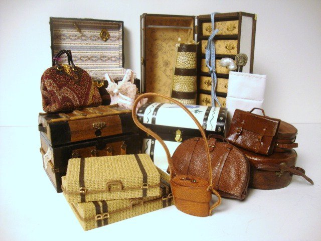 Loads O' Luggage: A large assortment of suitcases, trunks, etc.; some very nicely detailed including one by Rosemary Tucker covered with leather and beautifully finished inside 2" H, 3" L, 2.25" W.