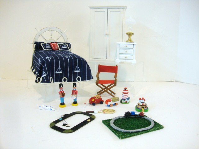Sailor's Rest: A nautical themed bedroom suite comprising a sweet upholstered bed with ship's wheel headboard signed by Carol Young 1996 and measuring 5" H, 6.5" L, 5" W, a Concord painted nightstand with lamp, a di