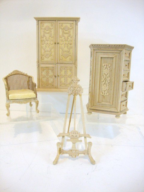 Unfinished Bespaq Furniture: An unusual unfinished two-sided chest of drawers 5" H, 3.25" W, an armoire 6.25" H, an easel and a caned bergere with removable cushion.