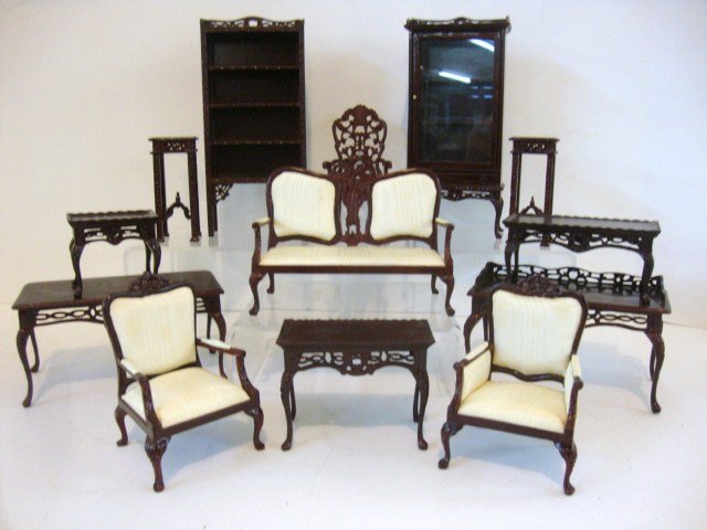 Bespaq Library Furniture: Fretwork bookcase on stand 6.5" H, an upholstered loveseat with two matching armchairs, glazed bookcase on stand, fretwork desk with leather-seat chair Legs reglued) and four assorted tables.