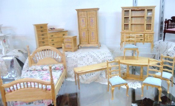 Dining Room & Bedroom Furniture: Oval Dining Table with four chairs, Hutch, Bed with Floral Covering, end table. Dresser Chest, Side Tables, unknown maker. 11 pcs. 6" tallest