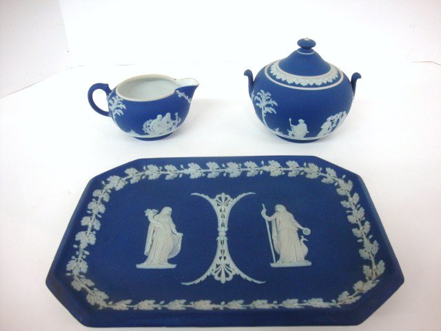 Wedgewood Creamer and Sugar: Dark blue Wedgewood Jasperware creamer and sugar with serving tray marked wedgewood England. Tray 10 1/2 x 7 1/2".