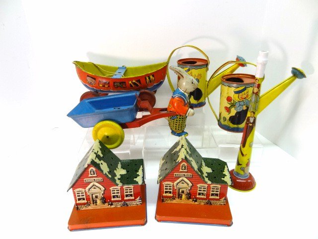 Early Tin Watering Cans, Boat, Rabbit, Banks: Seven pieces: two Ohio Art Tin Rabbit, Wyandotte Ark, Horn, two banks.