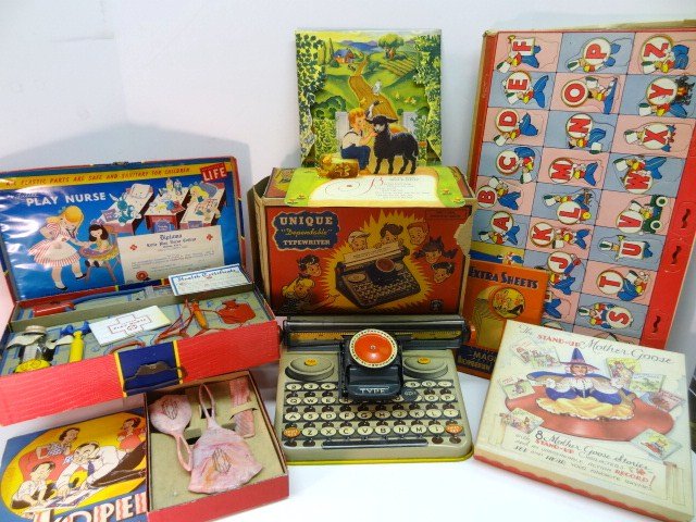 1940's Toy Lot: Games, Typewriter, Books, etc. : Unique typewriter in original box, Mother Goose stand-up books with record in original box, Transogram Little Nurse in original box, Kiddie Dresser Set in original box, ABC Junior Jiggles in original 