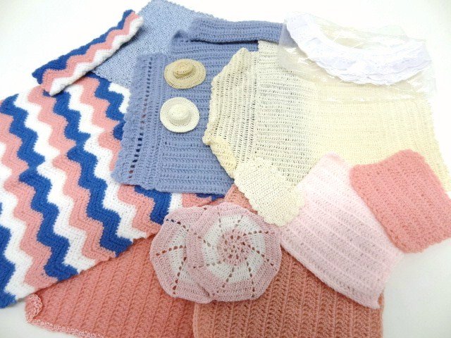 Assortment of Crochet Bed Linens: Over a dozen crocheted items including bedspreads, mats, pillows, baby blankets and two tiny hats.