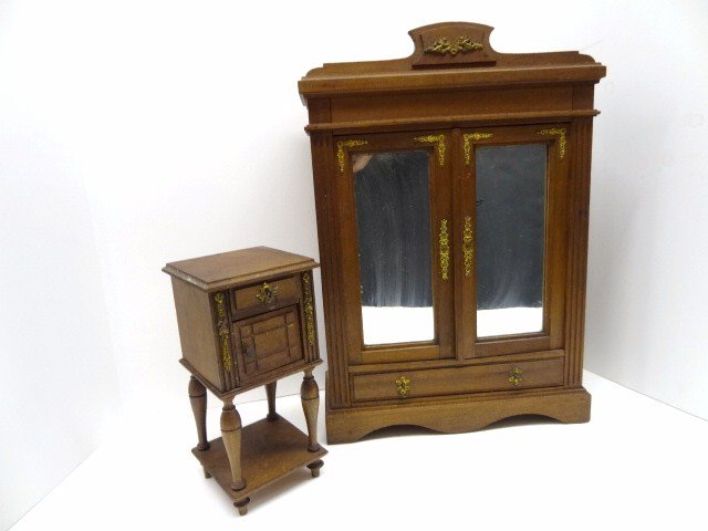 Victorian Doll Furniture: Incredible Victorian mirrored door armoire with ormolu trim on crest and sides, with bottom drawer, together with matching nightstand. Armoire 18 x 12 x 4", nightstand 9 x 4 x 4".