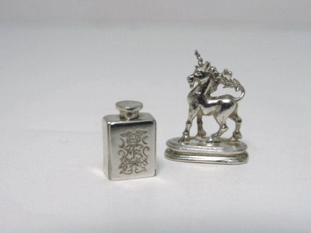 Peter Aquisto Sterling: Peter Aquisto Sterling Unicorn table ornament, in the style of a medieval Unicorn on Base, together with Tea Caddy, circa 1735, original by John Swift, London England