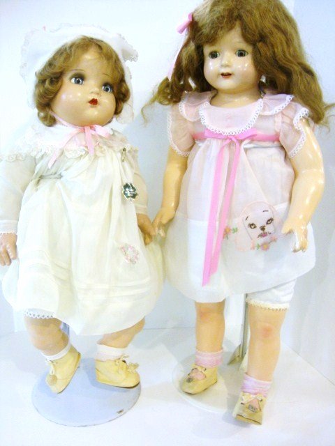 Effanbee and Madame Alexander Composition Dolls: 26" Effanbee Rosemary Composition Doll with beautiful face, slight color missing on some legs, but composition is very good. She is redressed. Also a Madame Alexander Baby Genius 23" in original cloth