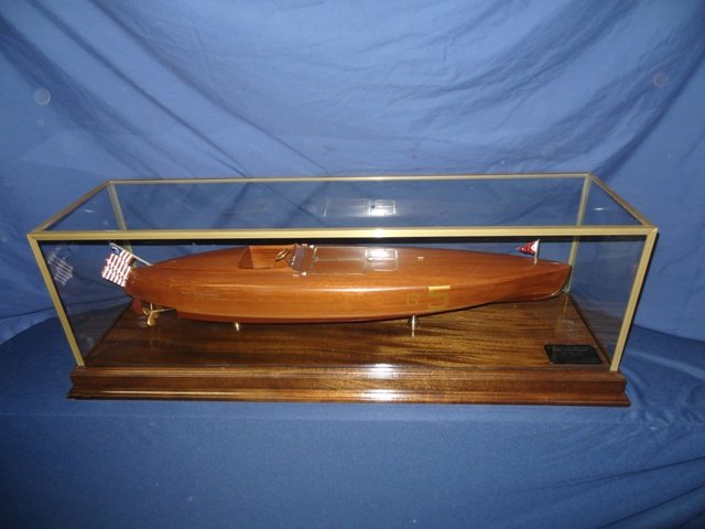 20th Century Model of the Speedboat Baby Bootlegger: Finely planked late 20th century model of the competition speedboat Baby Bootlegger. Fittings include controls, instruments, wheel, hatches, pennant, flag, etc., fitted into an inlaid mahogany & glass