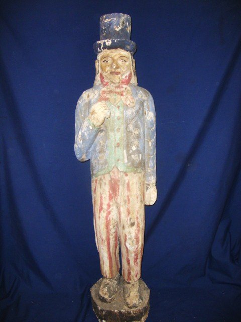 20th Century Uncle Sam Carving: 20th century wood carving of Uncle Sam, excellent carving, w/flaked paint, top hat & red/white/blue outfit, 48 (h), 13 (w)