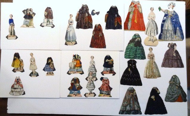 Six Partial Sets: Vintage Paper Dolls: seven dolls and costumes, two Jenny Lind, four children: three girls and one boy, all with outfits.