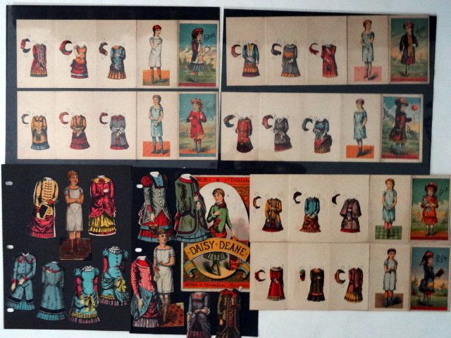 Peter Thompson Sheets and Dolls: Vintage paper dolls by Peter Thompson. Six uncut sheets: Alice, Mary Bell, Ruth, Sallie, Louis, Rhoda, Daisy Deane with envelope (cut) with clothing, and Nellie Bly (cut) with clothing.