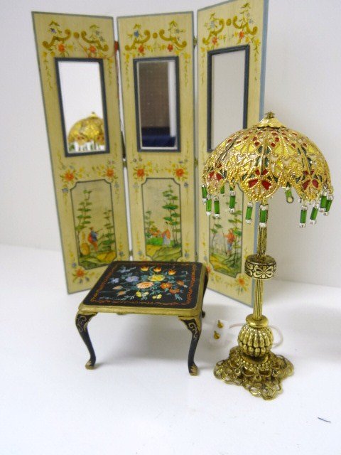 Rosemarie Torre Screen and Table: Stunning three-panel folding screen with mirrored inserts and decorated with Chinese scenic panels 6.5" H, 5.5" W, a small occasional table with beautifully hand-painted floral top 1 3/8" H, 2" W, and