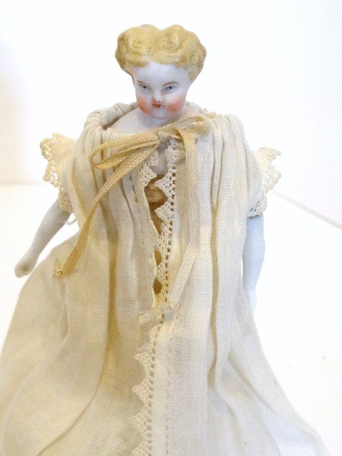 Parian Doll House Doll: Parian dollhouse doll 5", blonde short curly hair, blue eyes, cloth body, Parian lower arms and legs, black flat sole boots, dressed in vintage undies & white dressing gown.