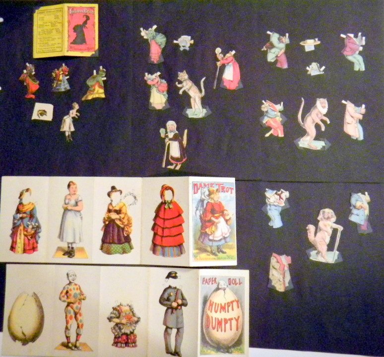 Six Special McLoughlin Dolls: Dame Trot uncut, Humpty Dumpty uncut, Grecian Bend, 2 " with three outfits one hat, original folder, Fido Dog 3", with three outfits, Jacko Monkey with four outfits, two hats, Tabby Cat 3" four outfit