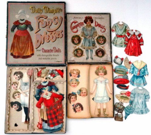 Two Spears Paper Dolls in original boxes: Spears Character Dolls complete in original box, Doll with six heads, four different costumes, each with a hat to match and besides this a muff, a shopping bog, a parasol and a fan , jointed doll with