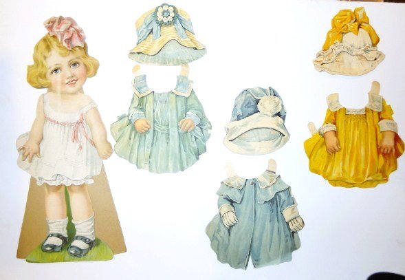 Juvenile Dressing Doll: Juvenile Dressing Doll , Set No 1, Mabel with original envelope as is, Doll 19" , three dresses and two hats, on foam board 24 x 18"