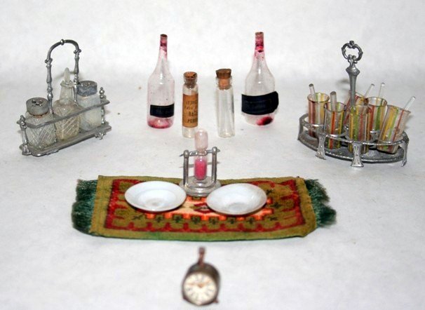 Antique German Cruet Set: Soft metal cruet set with original glass salt, pepper and cruet with stopper, also a set of iced tea glasses in soft metal holder, with glass spoons, two wine bottles with residue, an interesting work