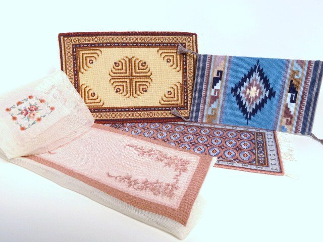 Petitpoint Rugs: Judy Kaelin Agra carpet 4" X 6.5", a Joyce Victorian runner 3.5" X 8.5", a tribal rug, an unfinished runner (just needs hemming) and four matching chair seat covers. All fine gauge petitpoint.