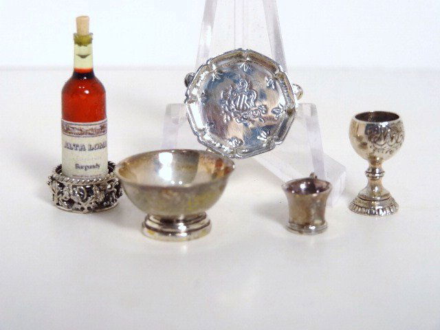 Peter Aquisto Miniature Sterling: Five pieces of Peter Aquisto fine sterling silver comprising a wine coaster, footed tray, chalice, Paul Revere bowl, and a handled cup, all bearing his distinctive mark.