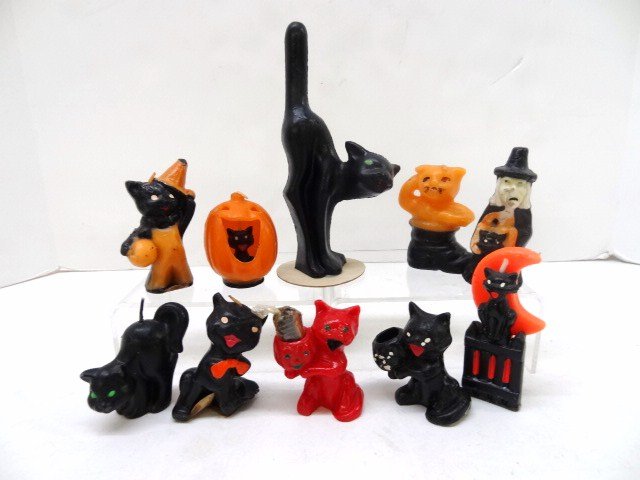 Halloween Candles: Eleven Halloween candles, black & orange, one red, pumpkins, cats, etc., 6 1/2 in. tallest