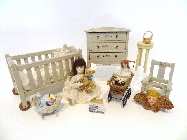 Vintage Lynnfield Nursery: A harder-to-find set of painted nursery furniture comprising a wheeled crib 3.25" H, 5" L, chest of drawers (adhesive residue on top) and potty chair with slight paint loss, a doll with teddy bear, lo