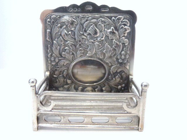 Miniature English Sterling: Fully embossed floral motif Fire back & log holder, marked with Lion Passant & HH on top, 2.5" H, mid 19th century, Henry Holland